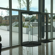 Minimalist full-glass revolving door for ISLAND tower Minimalist full-glass revolving door for ISLAND tower