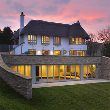 Rooflights bring ventilation and access to coastal cottage Rooflights bring ventilation and access to coastal cottage
