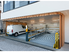 Side sliding garage door benefits stack up for parking lifts Side sliding garage door benefits stack up for parking lifts