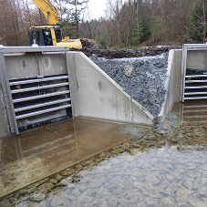 Factory fitting accessories to precast concrete headwalls