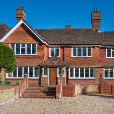 Traditional home refreshed with white replacement steel windows Traditional home refreshed with white replacement steel windows