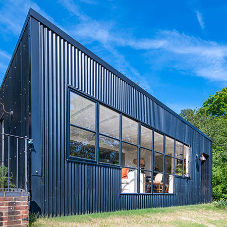 Modern extension using steel framed windows and doors maximises views and natural light