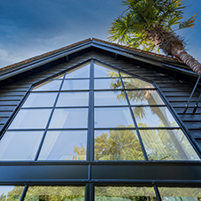 Steel door screens by Clement Windows feature at Grade II listed private residence in West Sussex Steel door screens by Clement Windows feature at Grade II listed private residence in West Sussex